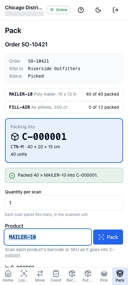 Packing an order in the worker app on a phone: the order’s lines, the carton being packed and the product scan