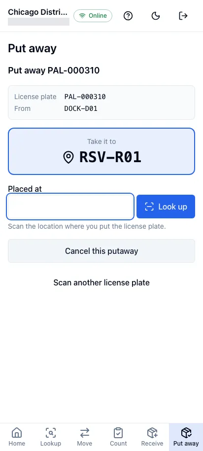 A license plate directed to a storage location in the worker app on a phone